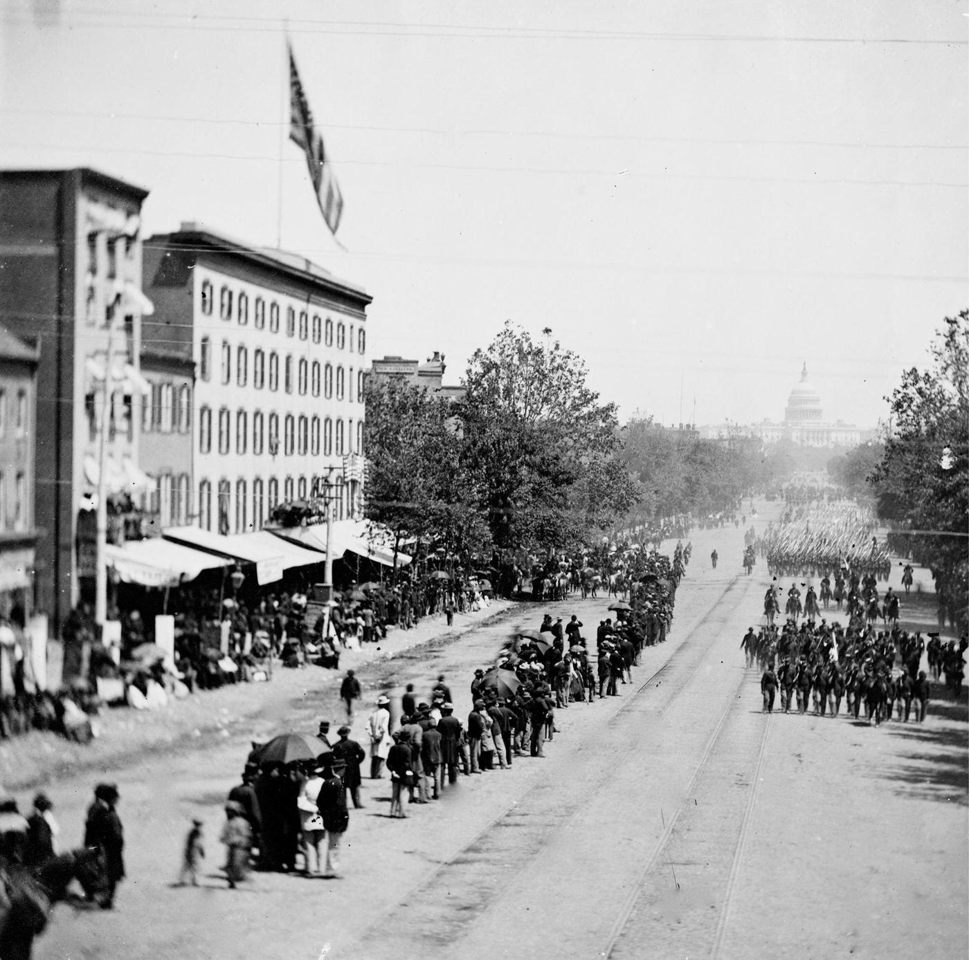 #166 Infantry passing on Pennsylvania Avenue near the Treasury, during the “grand review” of the Union Army, Washington, D.C., 1865