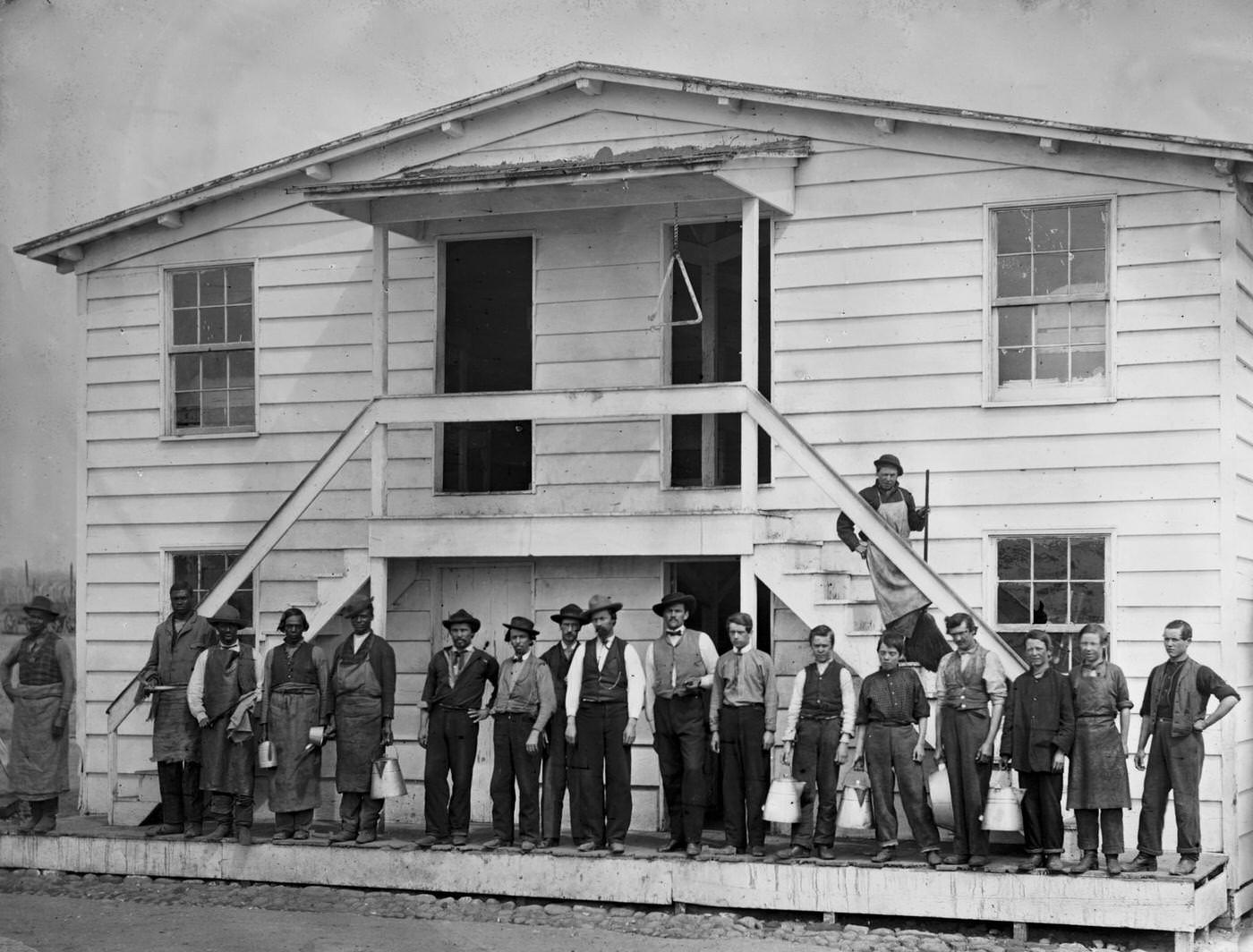 #176 Men standing in front of the mess house at the government stables, Washington, D.C., 1865