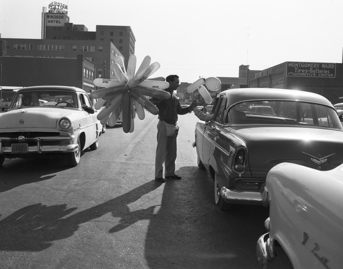 #153 A young man helping with a polio drive in downtown Abilene, 1955