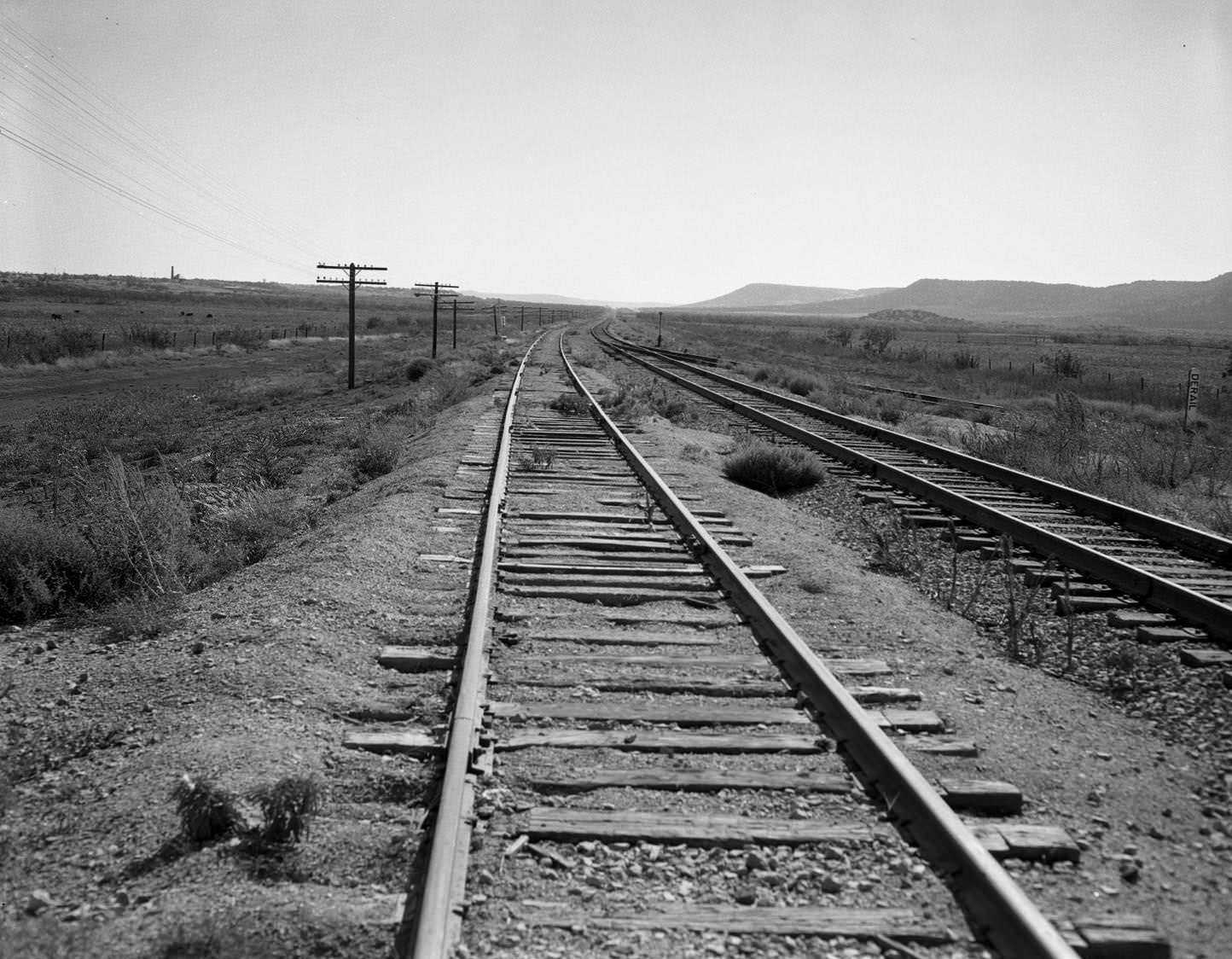 #70 Two sets of train tracks in the desert, 1955