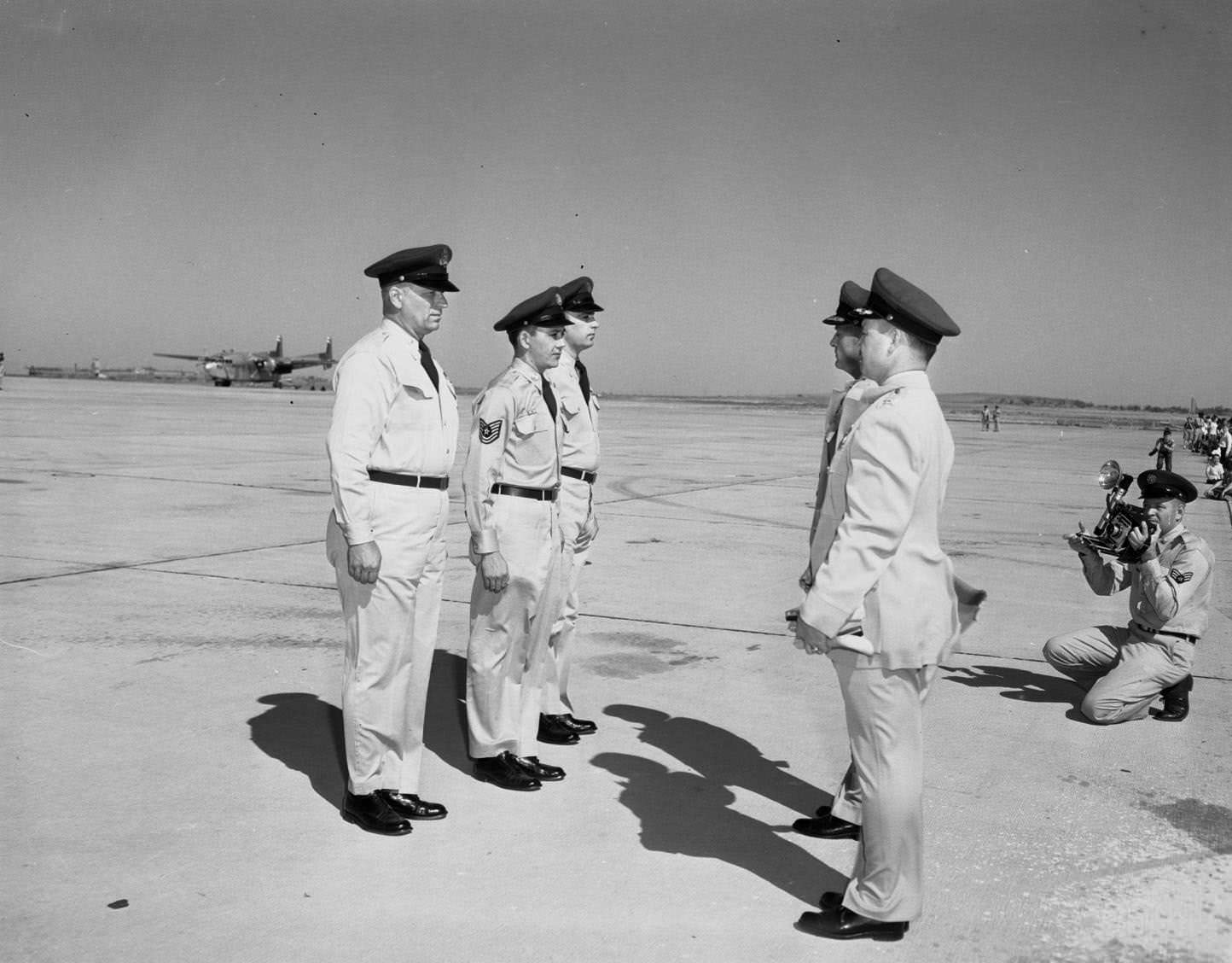 #75 Five Air Force personnel standing on a runway at the Dyess Air Show in Abilene, Texas, 1955