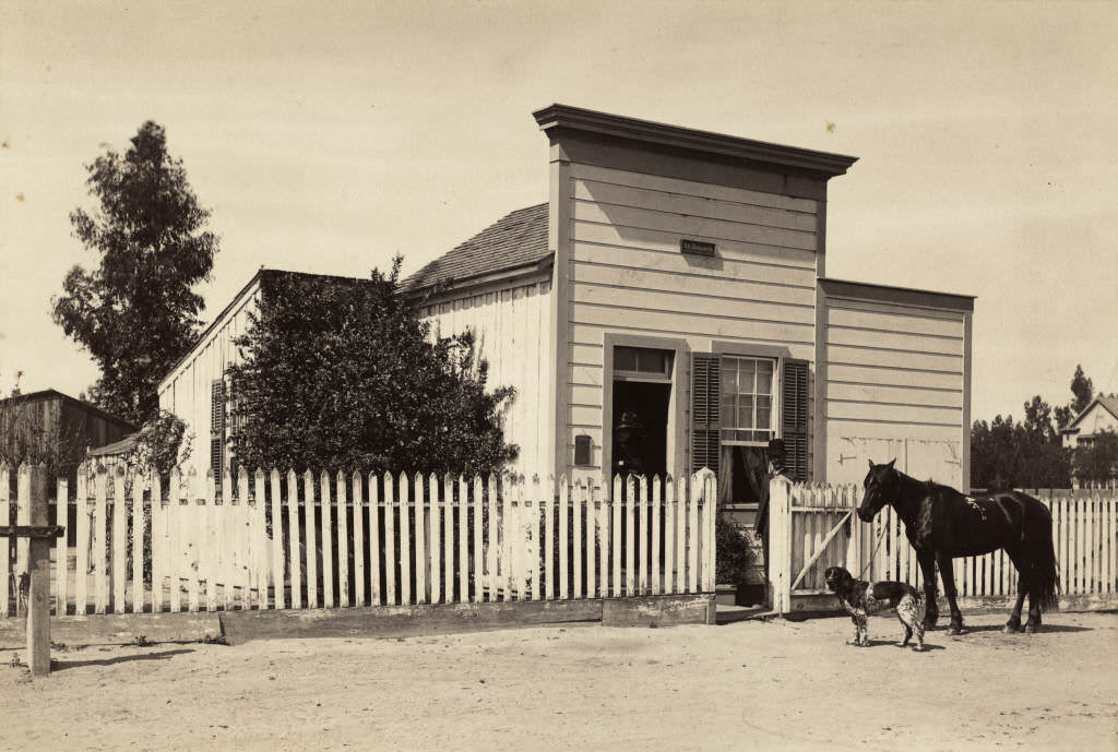 #24 Doctor James Hovey Bullard standing outside his first doctor’s office on Los Angeles Street (now Anaheim Blvd.), 1885