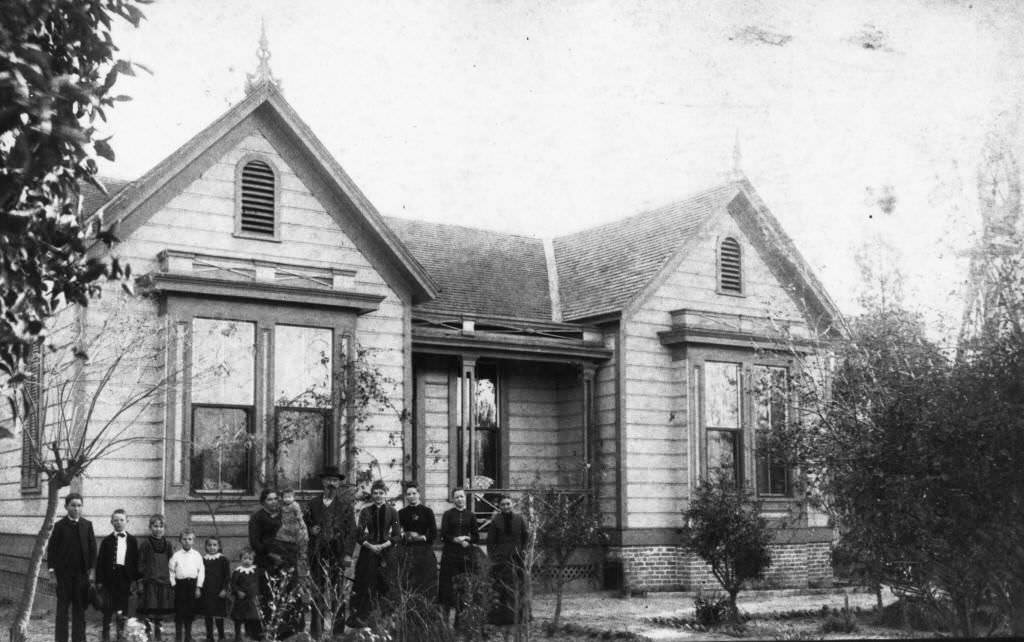 #35 Timm Boege family standing in front of their residence, located at 1006 West Center Street (now Lincoln Ave.), Anaheim, 1887
