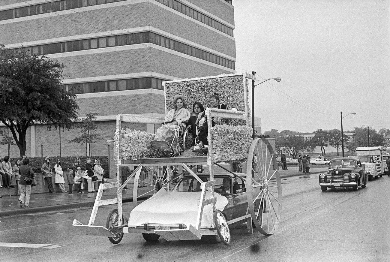 #20 University of Texas at Arlington’s Handicapped Student Association homecoming parade float. The parade was travelling northbound along Cooper Street in Arlington.