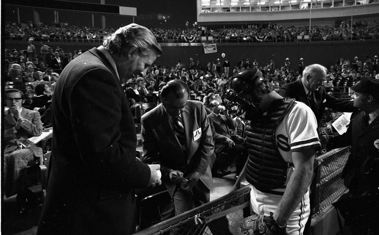 #60 Texas Rangers opening night at Arlington Stadium; Texas Ranger owner Bob Short and Arlington Mayor Tom Vandergriff signing autographs, 1972