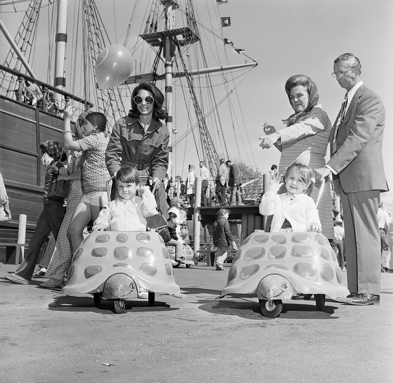 #63 Visitors to Seven Seas, children riding in turtle cars, Arlington, Texas, 1972