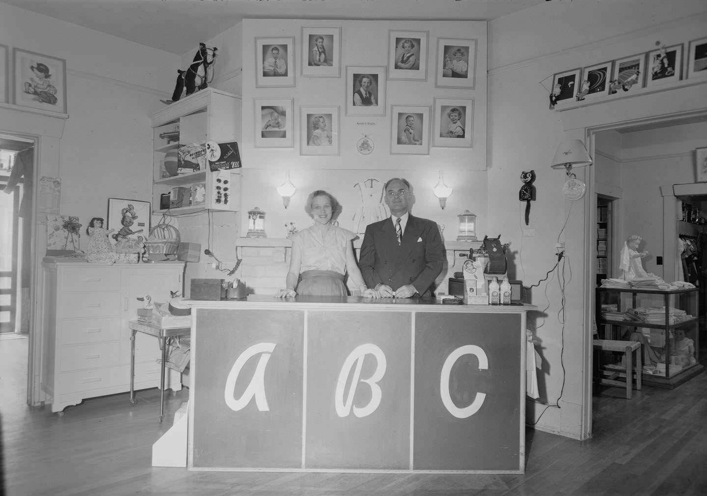 #112 Eve Marie Martin and George Martin stand behind the counter in the ABC shop, located at 809 W. 12th St. in Austin, 1951