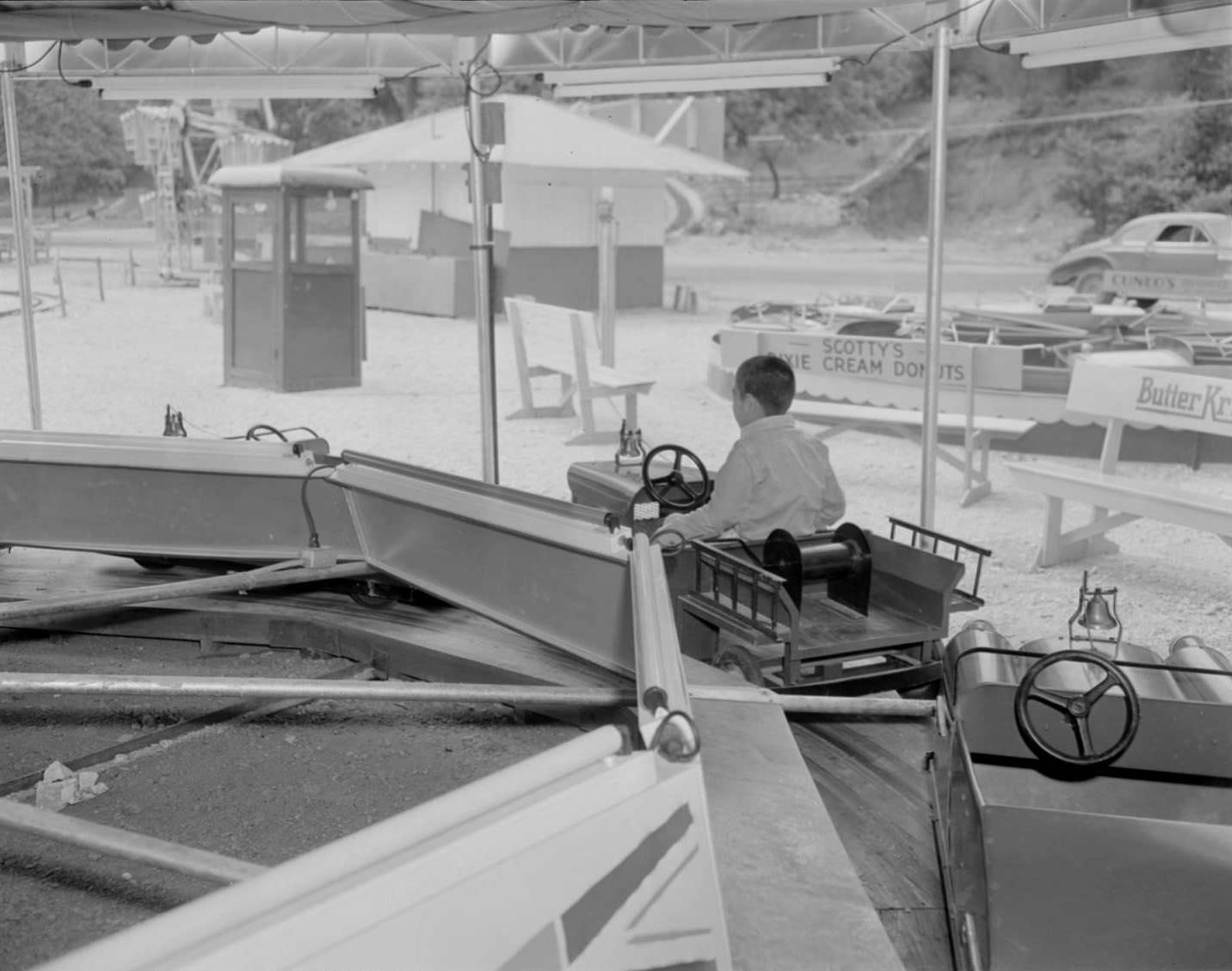#174 Boy riding on amusement park ride, Austin, 1950