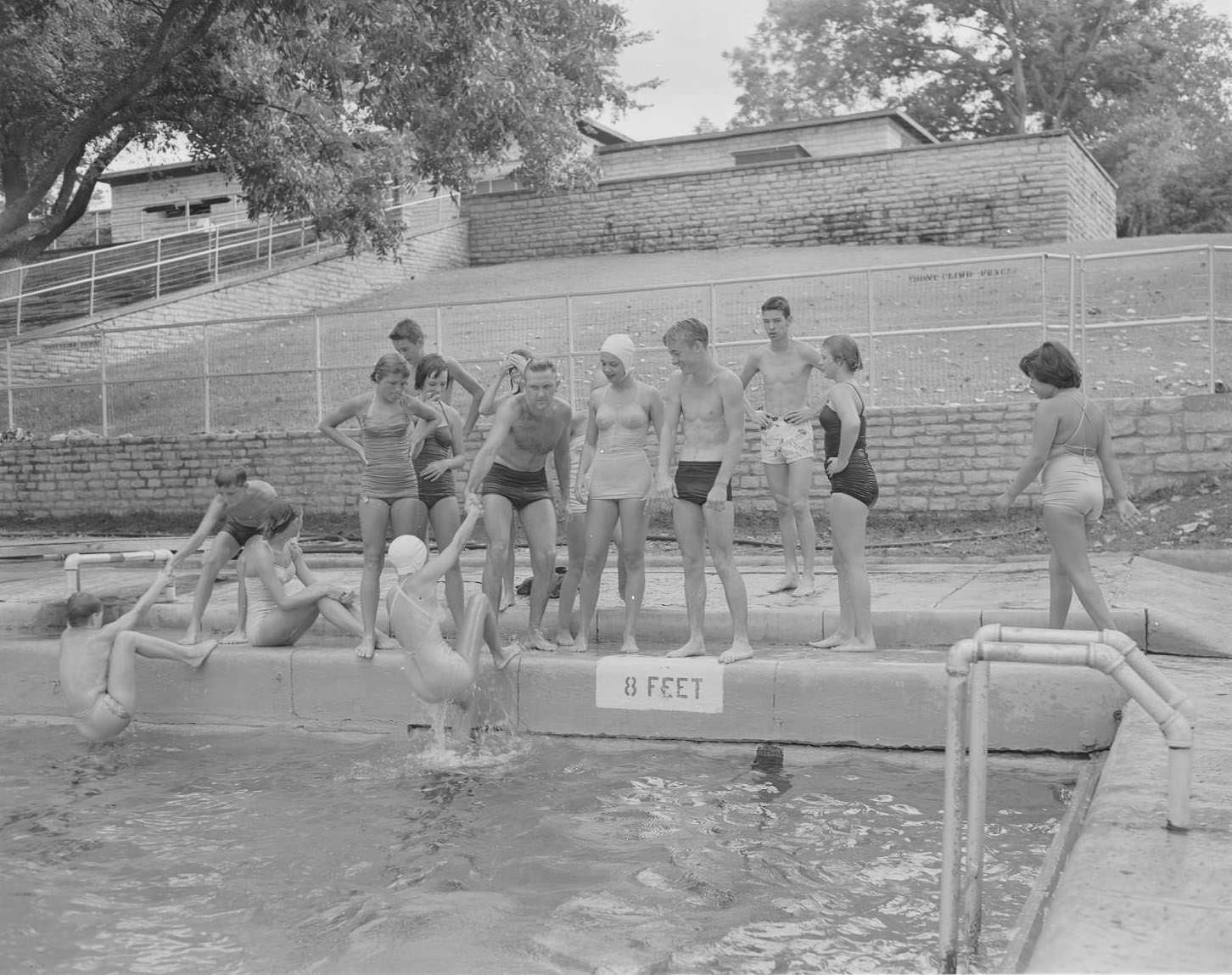 #176 Boys and girls standing at edge of Deep Eddy Pool, 1953