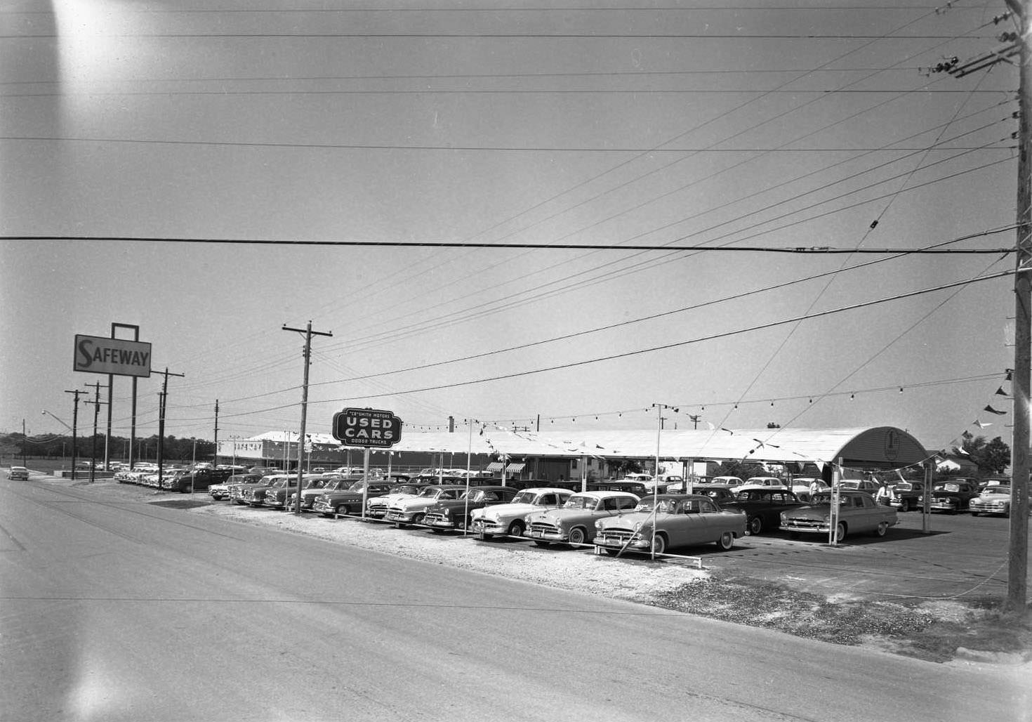 #182 C.B. Smith Motors Used Car lot at 5408 Burnett Road, 1955
