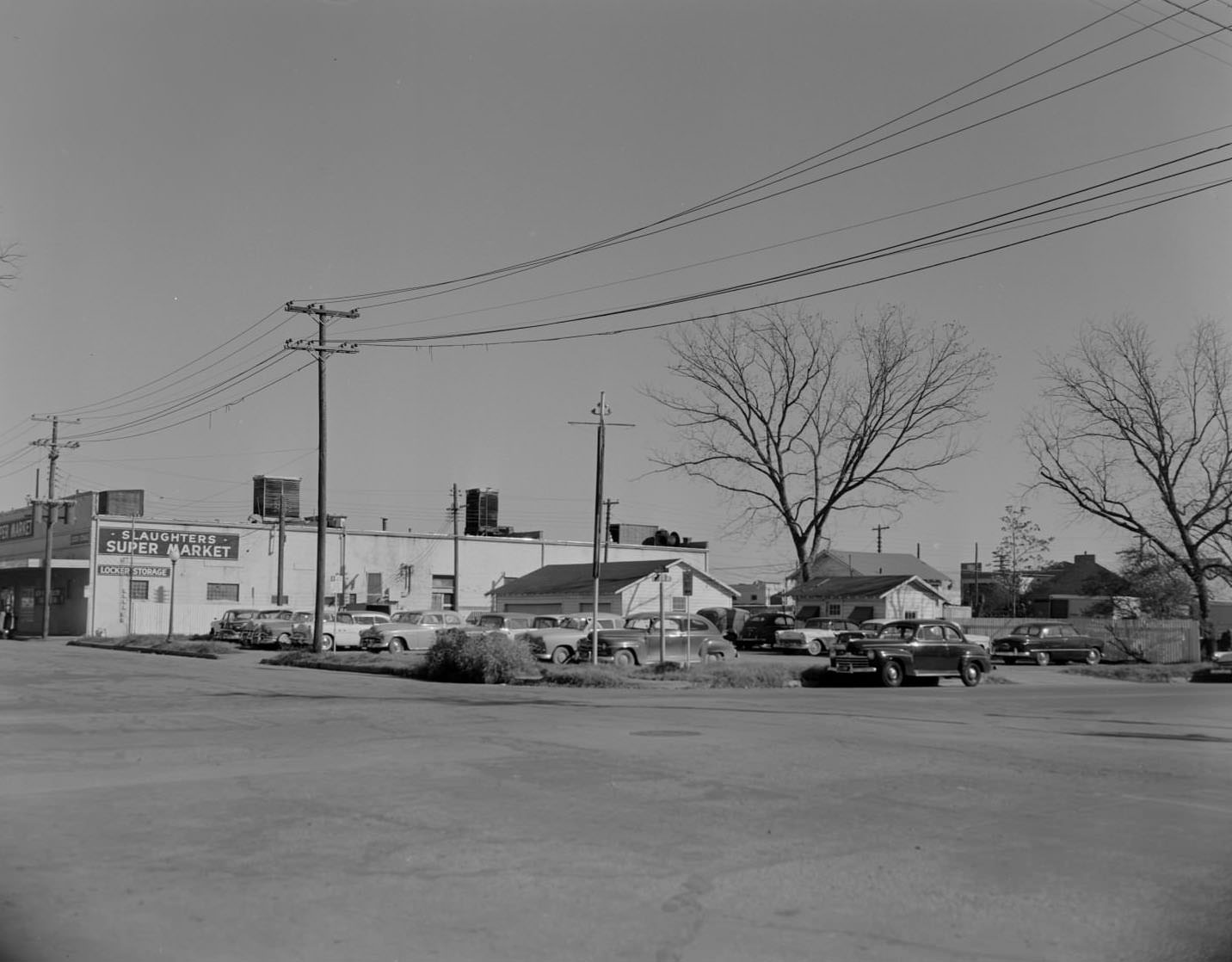 #193 Cars in lot next to Slaughters Supermarket, 1958