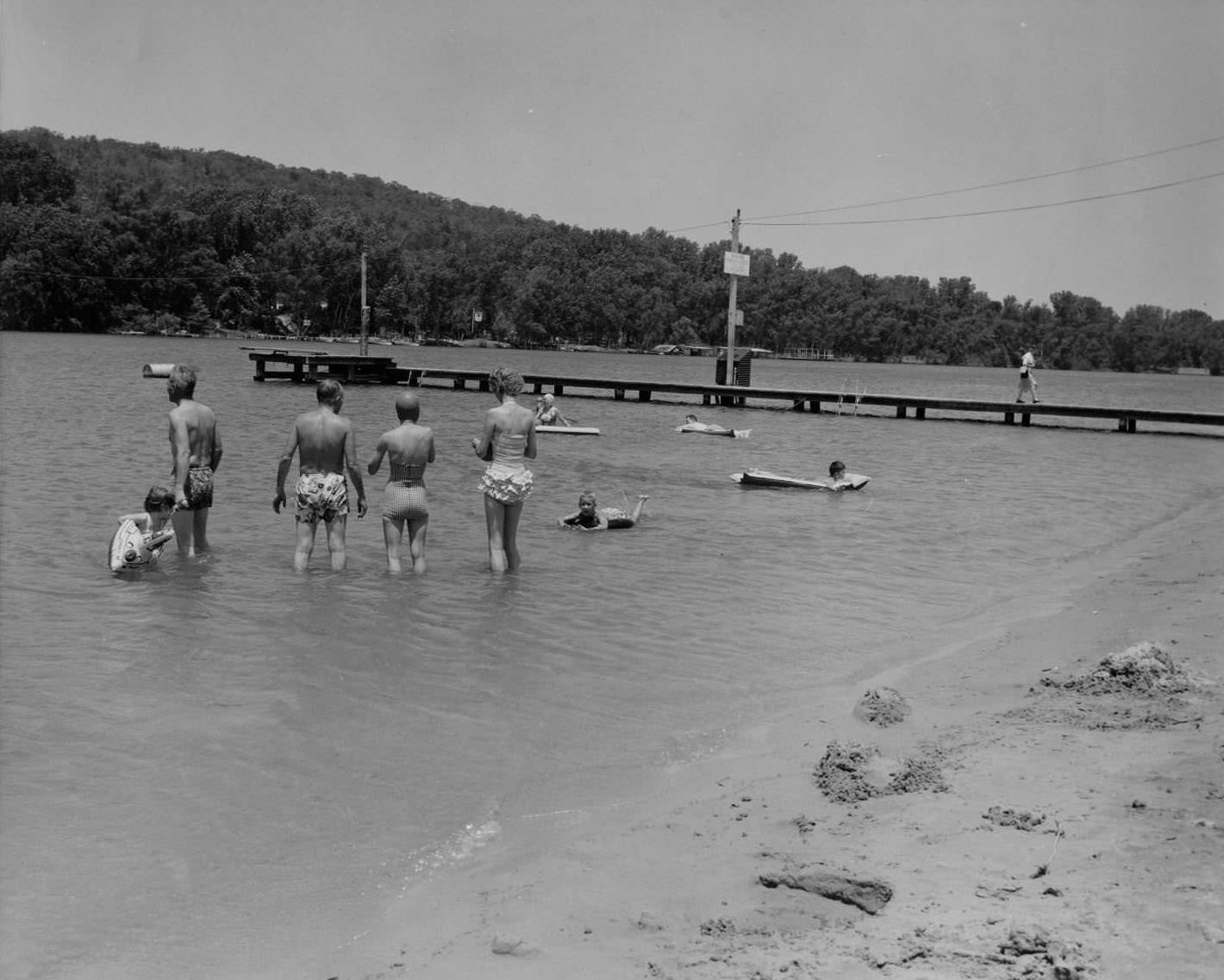 #47 People wading and floating in the water at Lake Austin Beach, 1956