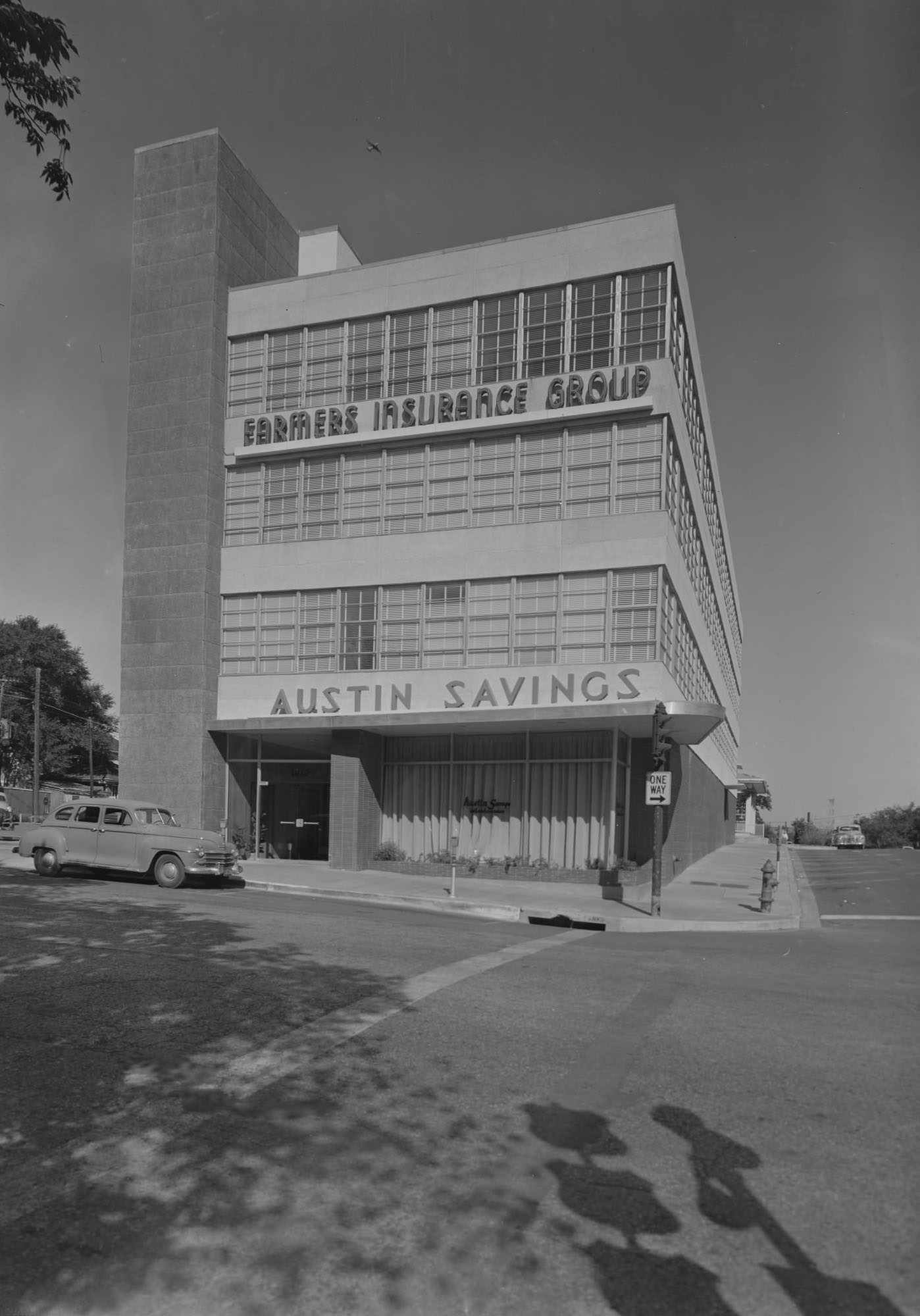 #49 View of one building which houses both the Farmers Insurance Group and Austin Savings, 1952