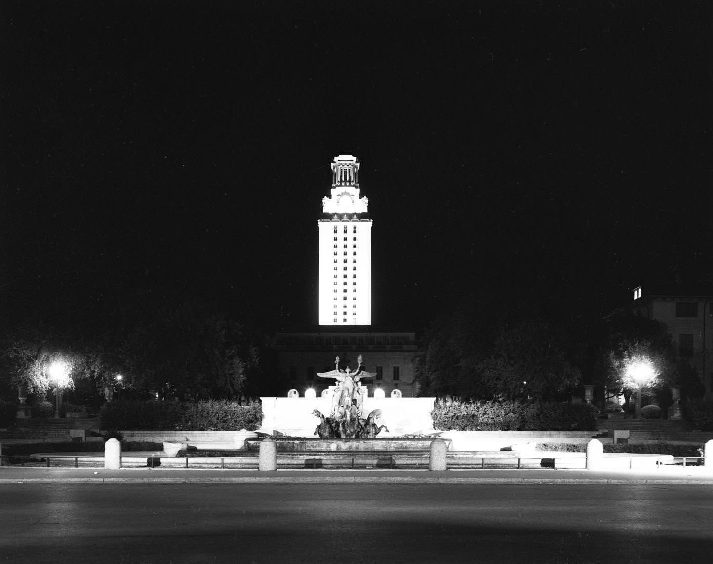 #34 Stark shot of the UT Tower lit up at night on 21st street, 1957
