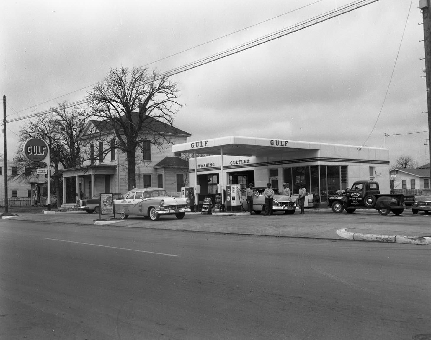 #65 Anderson’s Gulf Service Station and crew located on the 1700 block of East 12th Street, 1956