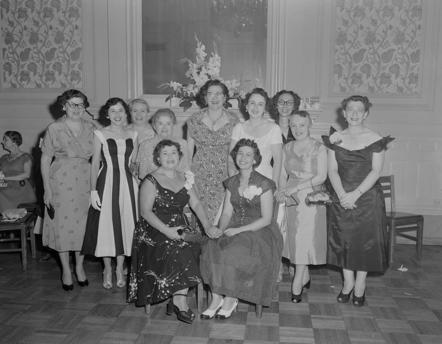 #92 A group of women from the Austin Chapter of Hadassah posing for a photo at a formal gathering, 1954