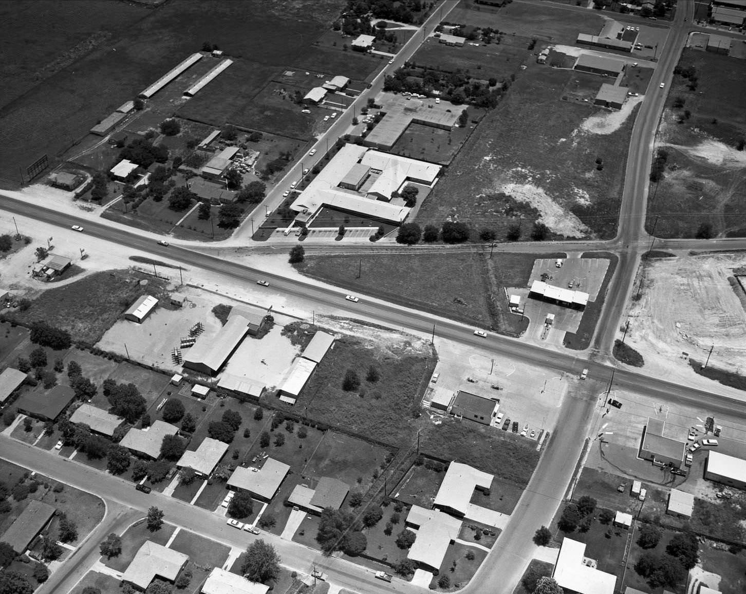 #155 Aerial shot of CB Francis Rest Home, 6909 Burnet Rd. Burnet Road running left to right in center, 1965