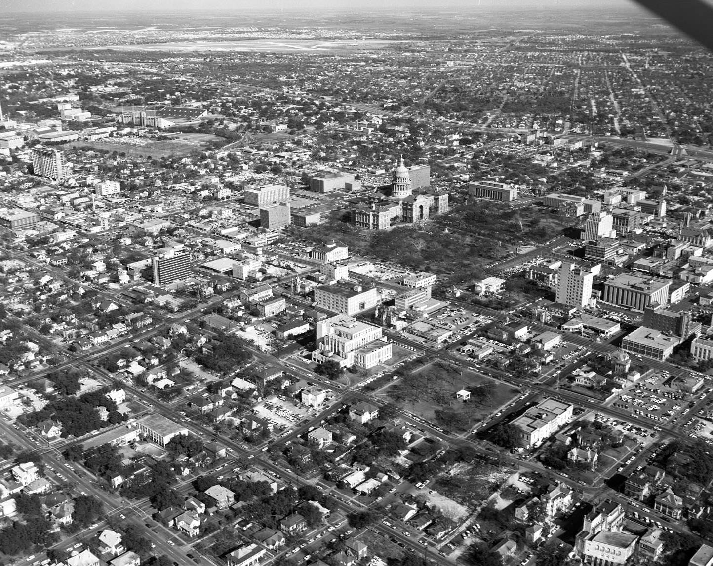 #156 Aerial shot of Downtown Austin, State Capitol, and in particular the Lowich Building, 314 W 11th St., 1965