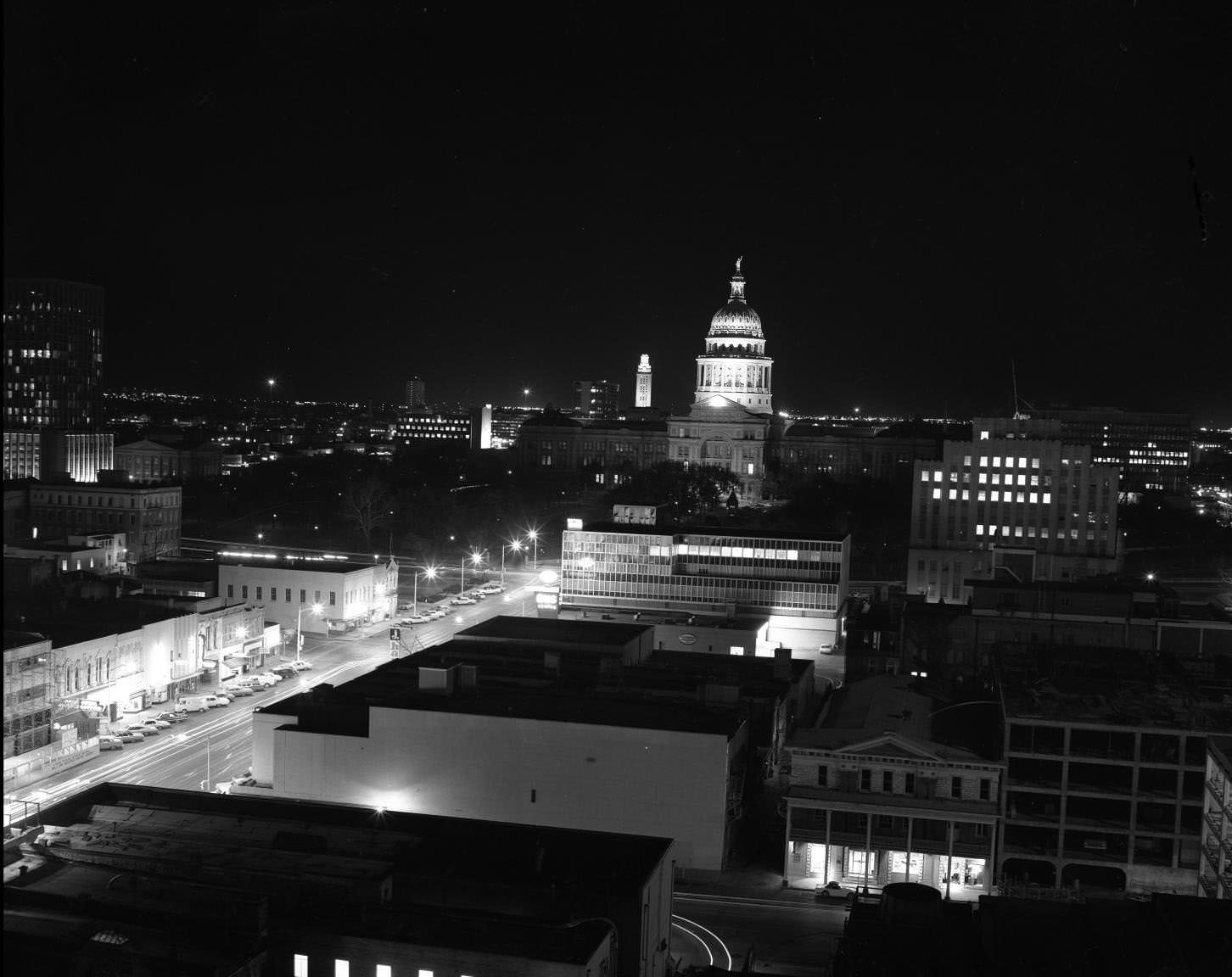 #163 Austin, Texas shot from downtown on South Congress showing the State Capitol lit up at night, 1968