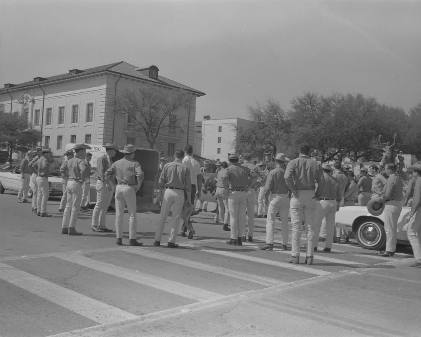 #167 UT Silver Spurs stand facing the Littlefield Fountain and UT Tower on 21st Street at the UT campus, 1965