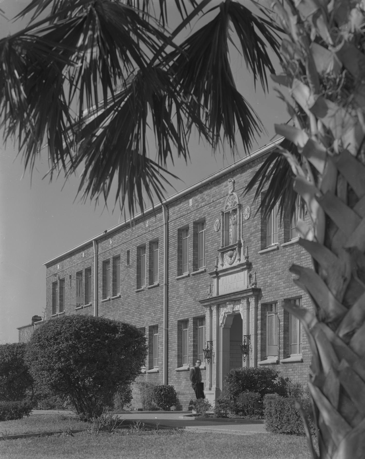 #68 The exterior of a decorative stone and brick building at Concordia Lutheran College, located at 3400 East Avenue, Austin, 1961