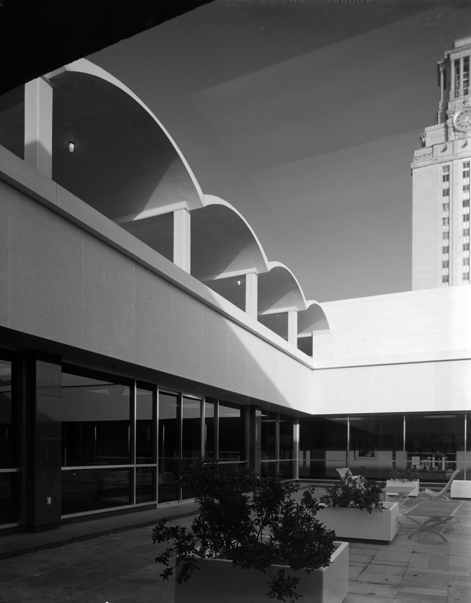 #182 The roof courtyard of the Peter T. Flawn Academic Center. The UT Tower is visible on the right side, 1964
