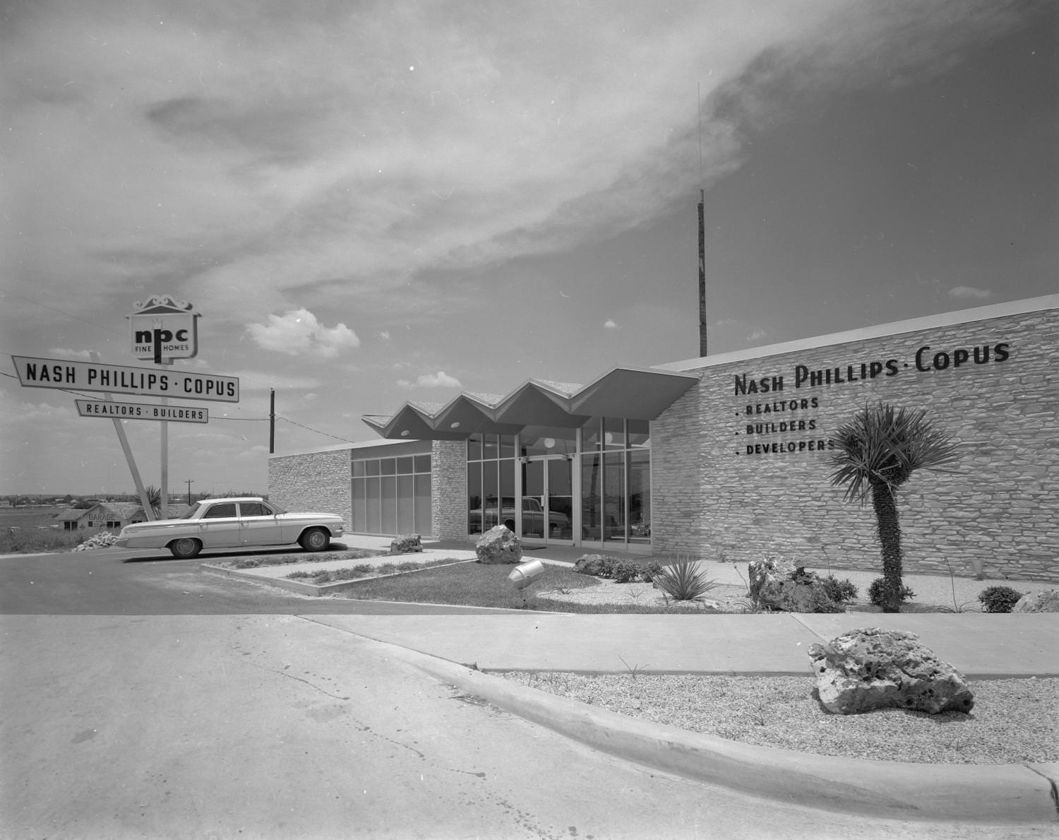 #70 The exterior of the Nash Philips-Copus realtor office, since demolished, on 6010 Brooks Street, 1964