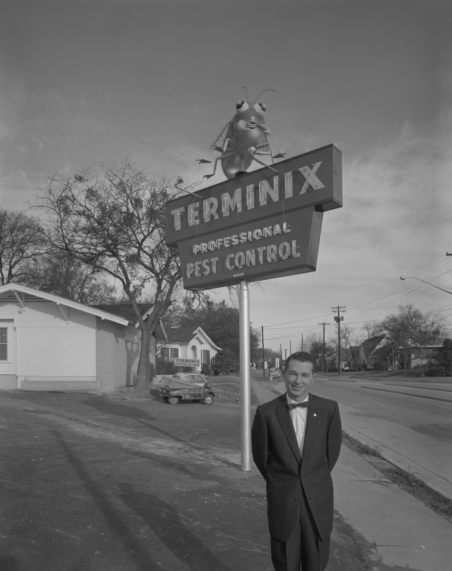 #19 Bill Youngblood in Front of Terminix Sign, 1961.