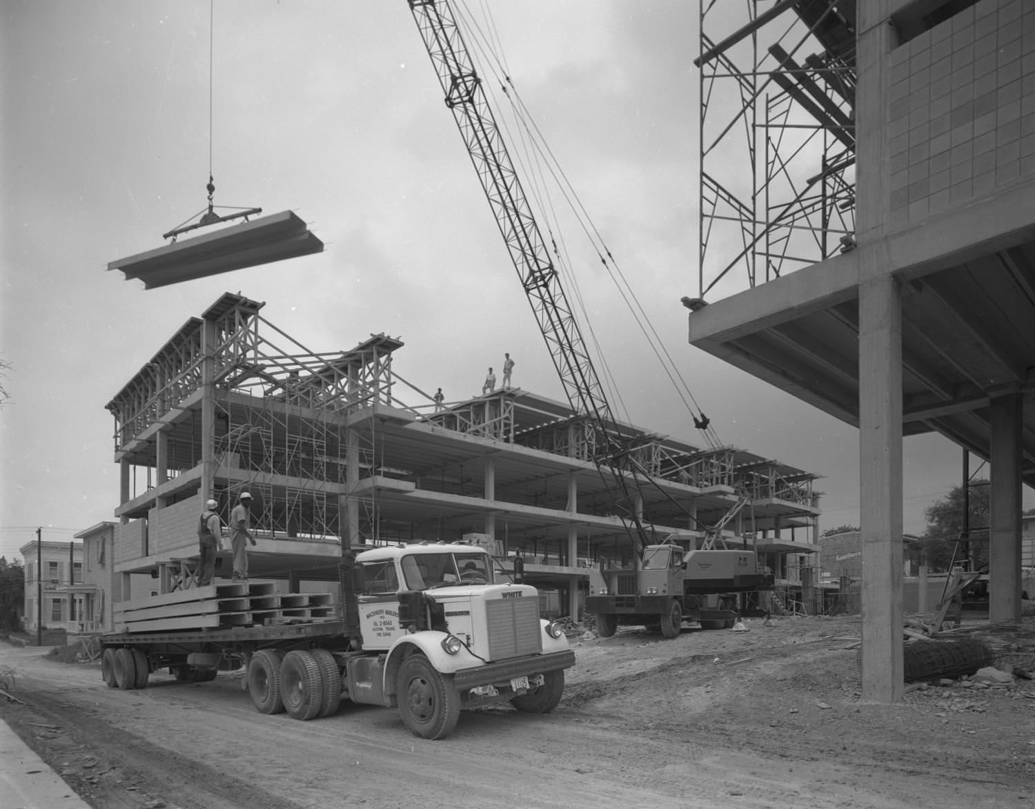 #201 A steel beam framed building under construction, 1965
