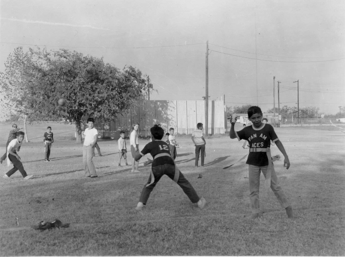 #42 Children, aged about 10-13 play flag football at the Pan Am Recreation Center, 1966