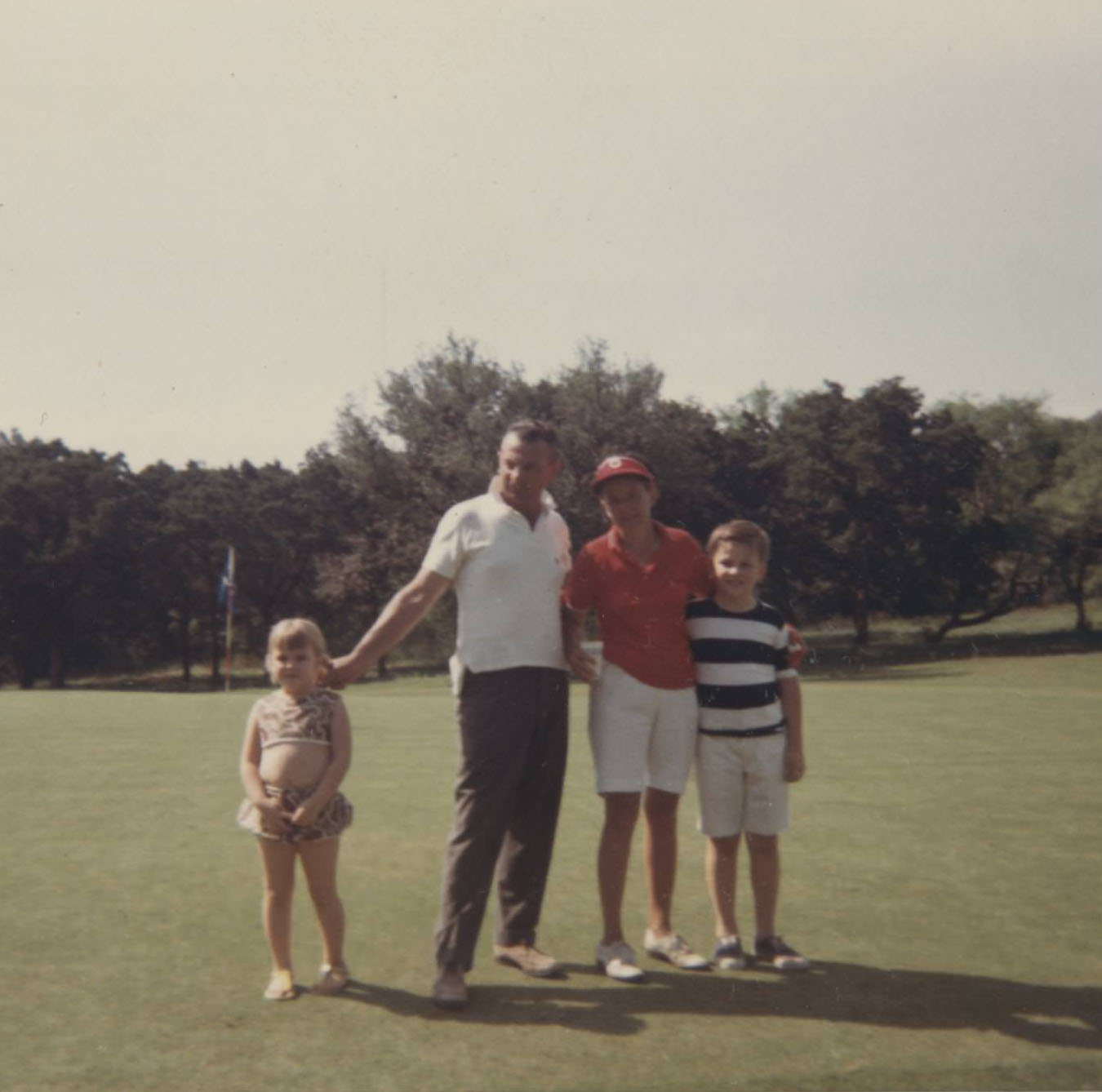 #112 Austin Women’s Public Links Golf Association golfer and family at Municipal Golf Course, 1966
