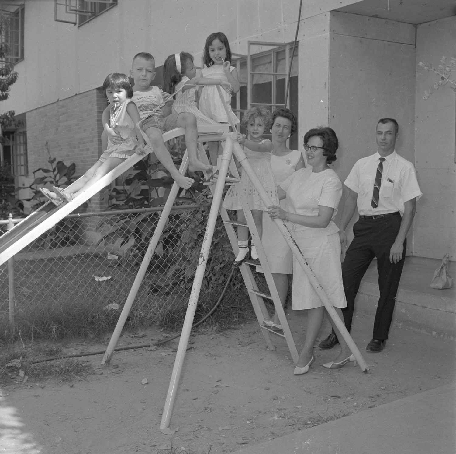 #128 Children on Slide, 1965.