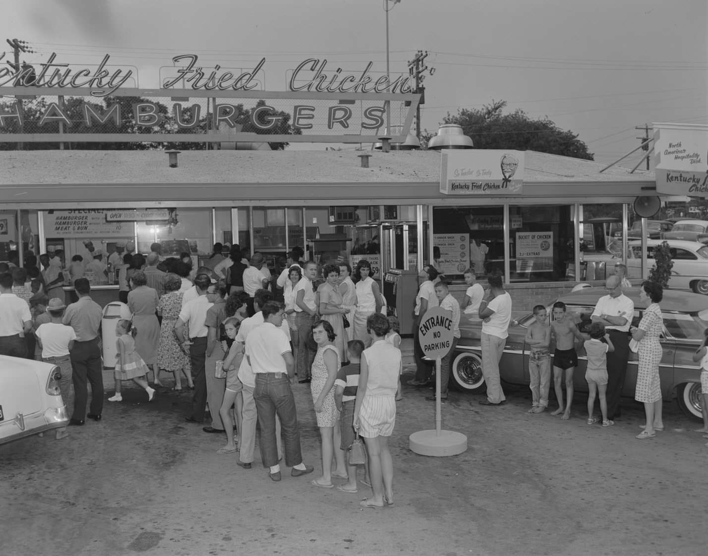#132 Customers standing in front of Kentucky Fried Chicken stand, Austin, 1960