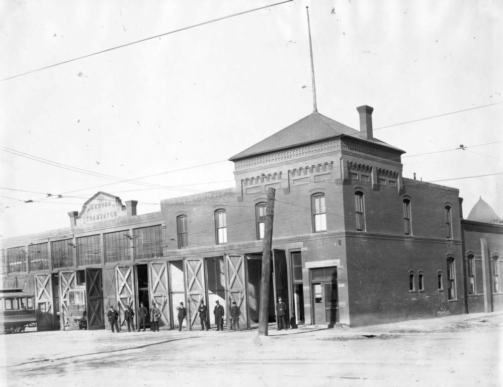 #148 A group of conductors in uniforms pose in front of the Denver Tramway Company garage on Gilpin Street, Denver, 1905