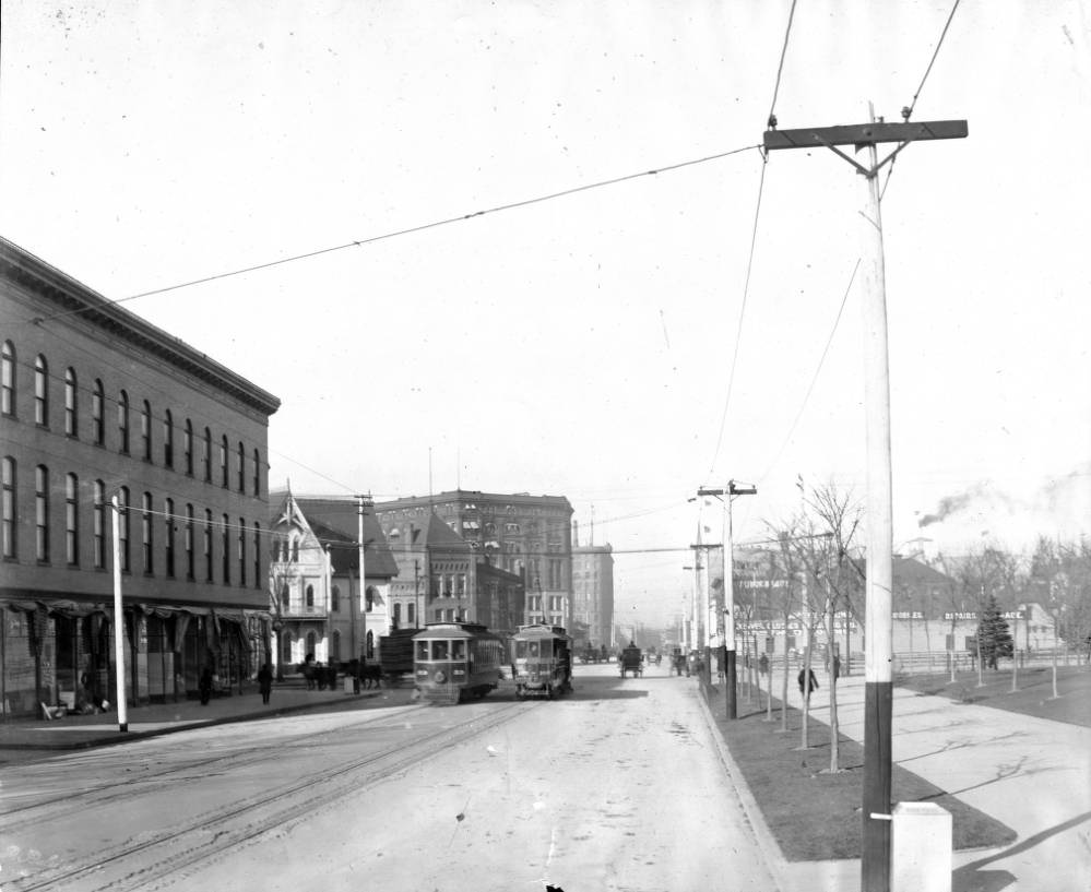 #24 View of Denver Tramway Company trolleys number 166 and 53 on Colfax Street at Broadway in Denver, 1900