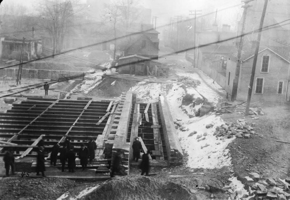 #171 Men (including Mayor Robert Speer) inspect Denver Public Library (Carnegie) basement and foundation walls in Denver, 1907