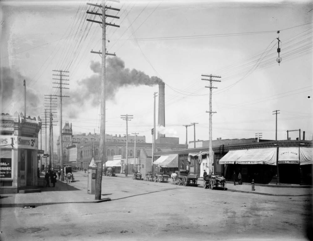 #30 View of 18th (Eighteenth) and Arapahoe Streets with the Denver Cable Car power plant smoke stack in Denver, 1909
