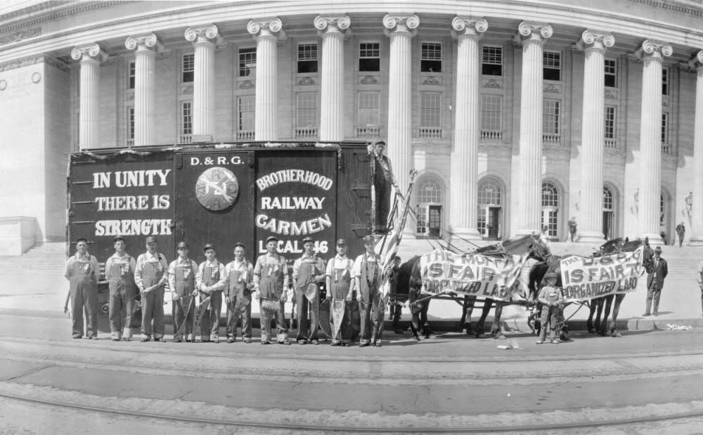 #26 Denver and Rio Grande Railroad employees, men and boys, pose by a horse drawn railroad boxcar in front of the Stout Street Post Office, in Denver, 1909