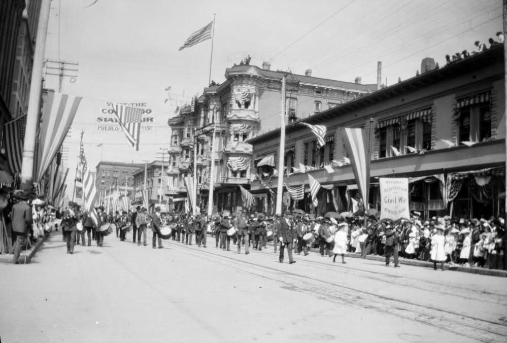 #60 A marching band participates in a parade on 17th (Seventeenth) Street in downtown Denver, 1900s