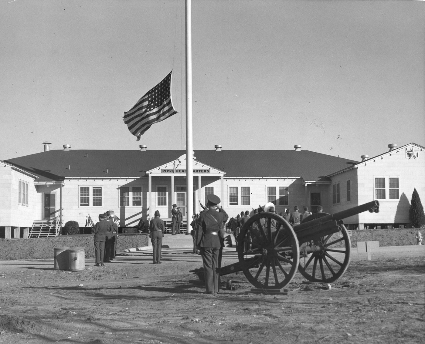 #161 Retreat soldiers saluting lowering of flag as cannon booms, 1943