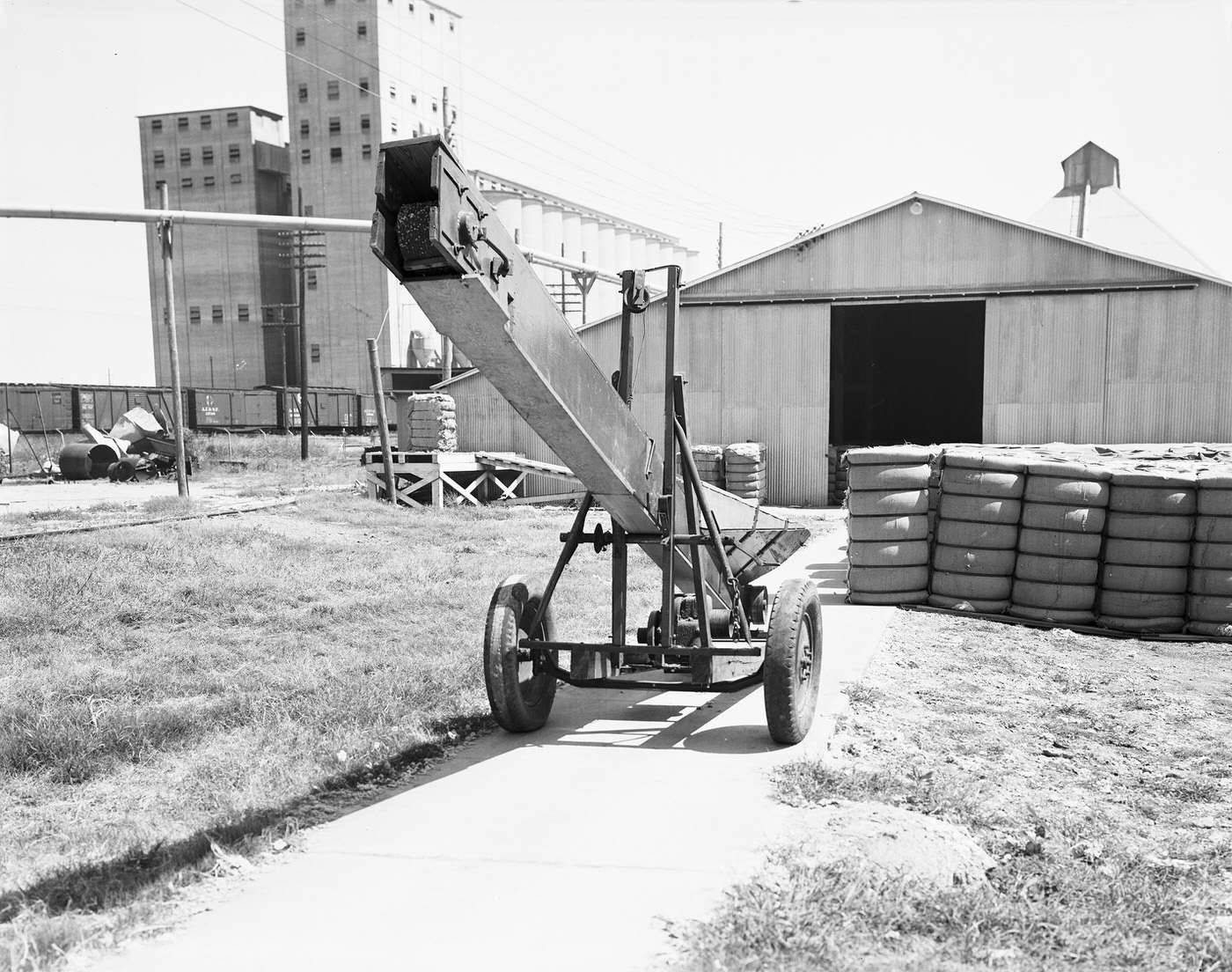 #51 Farm elevator and equipment outside the Traders Cotton Oil Mill Co. plant, 1943