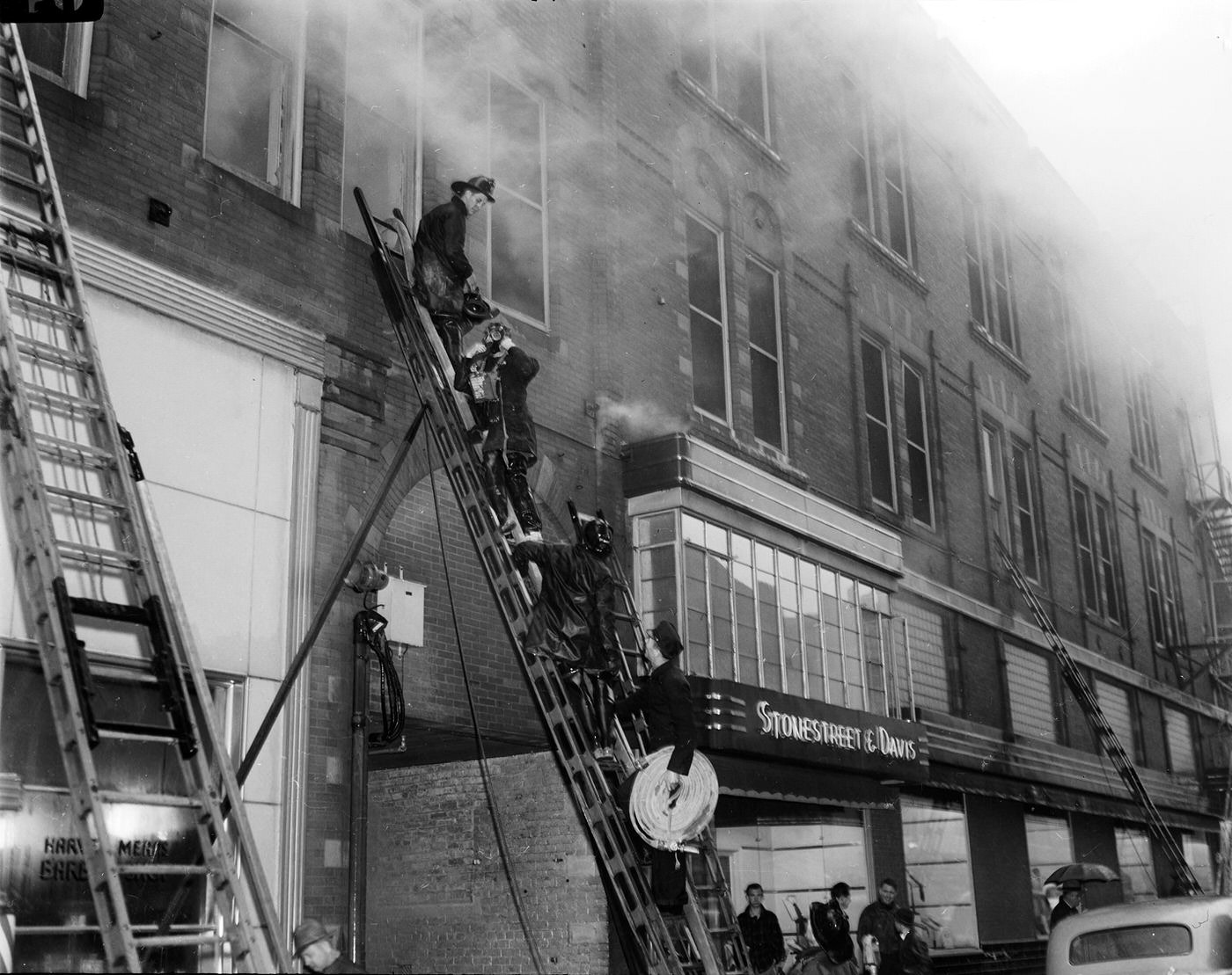 #148 Firemen on ladder fight fire at Metropolitan Hotel building, Fort Worth, Texas, 1943