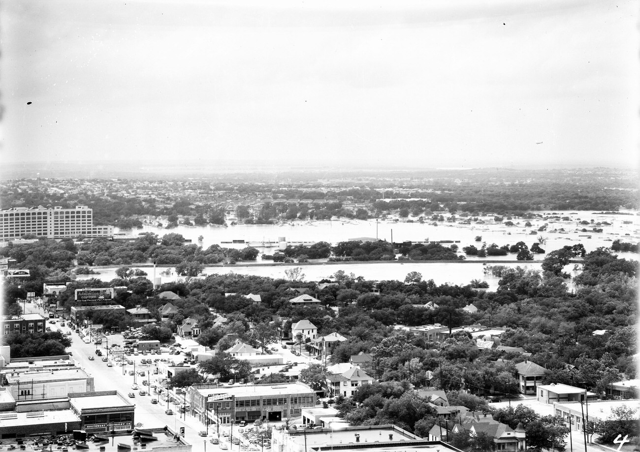 #101 Fort Worth Flood Scene Panorama. Buildings, roads, trees and flooded area are seen, 1949