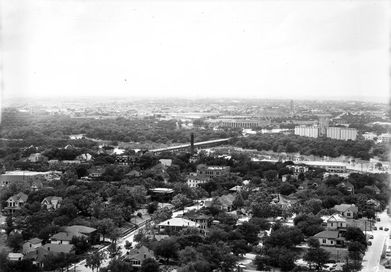 #105 Fort Worth Flood Scene Panorama. Buildings, trees and flooded area are seen, 1949
