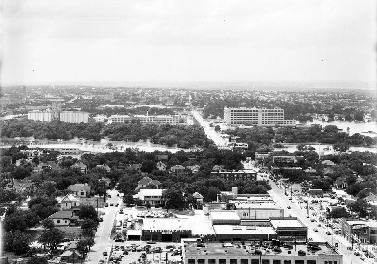 #49 Fort Worth Flood Scene Panorama.Buildings, trees and flooded area are seen, 1949