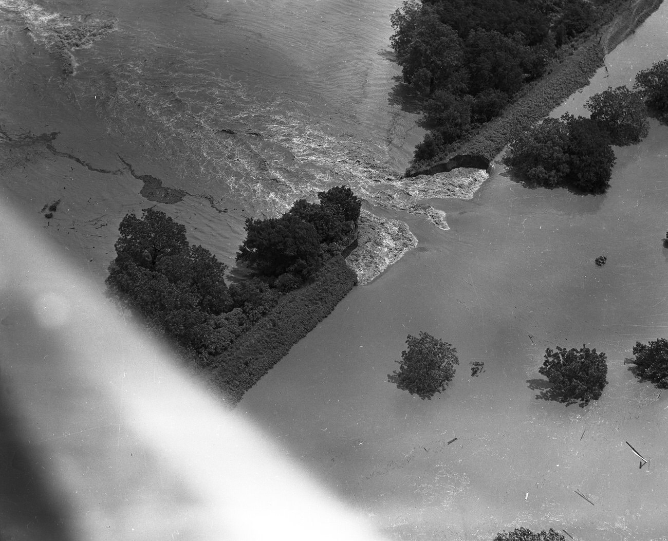 #76 Fort Worth, Texas, flood of 1949, showing a break in an earthen dam from a bird’s-eye-view.