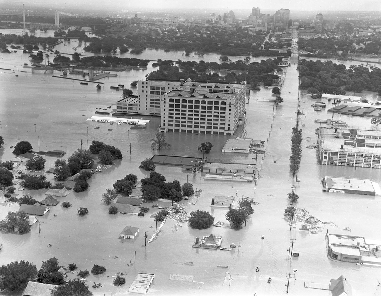 #80 Fort Worth, Texas, flood of 1949, showing 7th Street under water. The large Montgomery Ward building in the upper center received extensive damage.