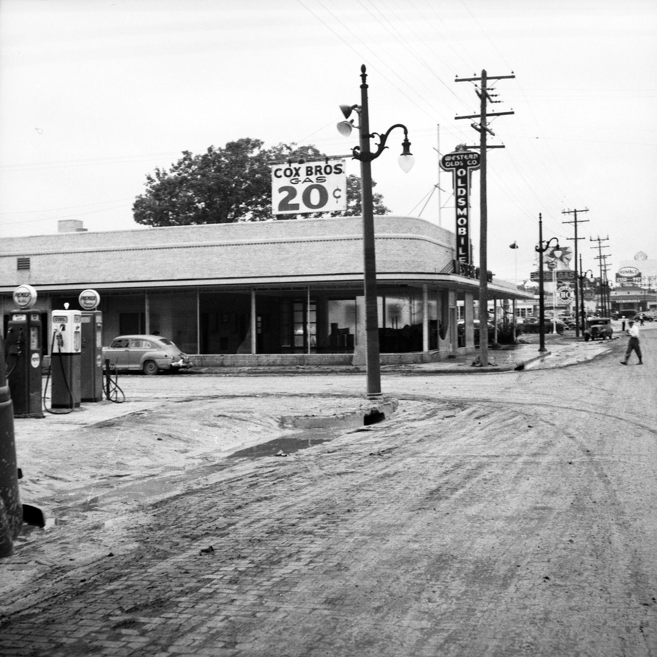 #86 Cox Brothers Gas station after flood, 1949