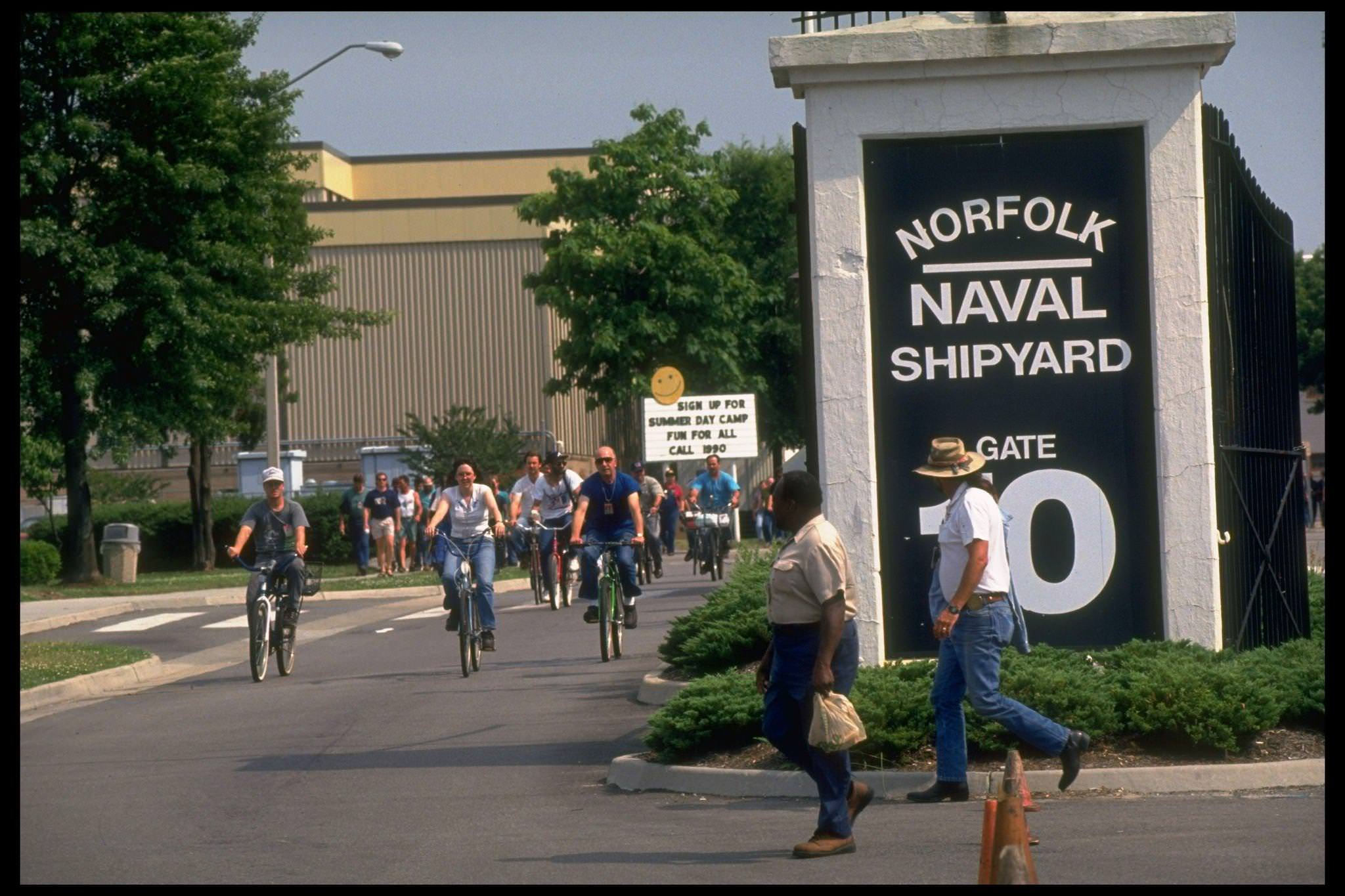 #2 Bicyling employees leaving Norfolk Naval, Norfolk, 1990s