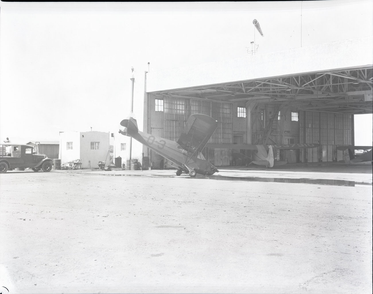 #16 Damaged Airplane in Front of Hangar at Sky Harbor Airport, 1942